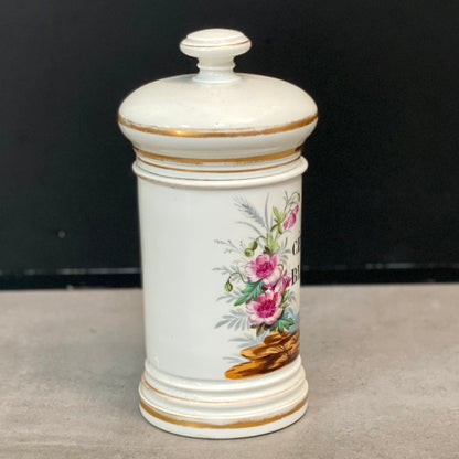 Pot à pharmacie en faïence avec couvercle à décor floral du XIXème siècle.